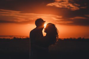 A happy couple at sunset.