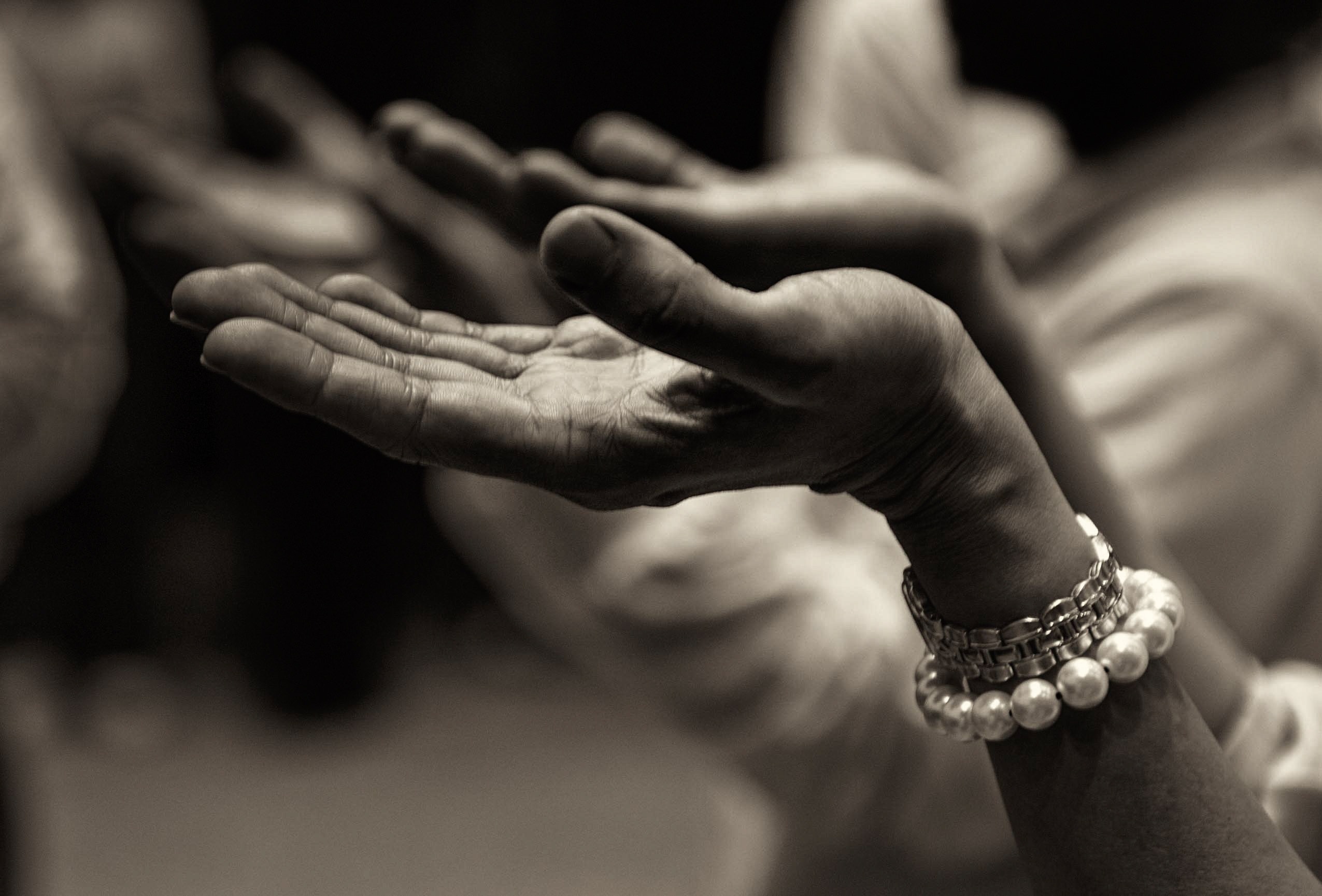 Hands lifted in prayer. 