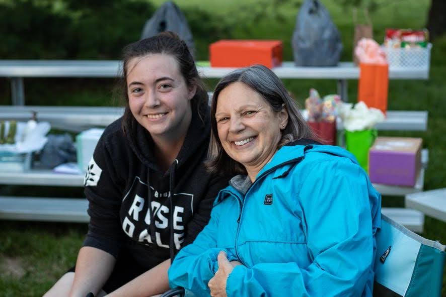 A mother and her daughter at a sporting event.