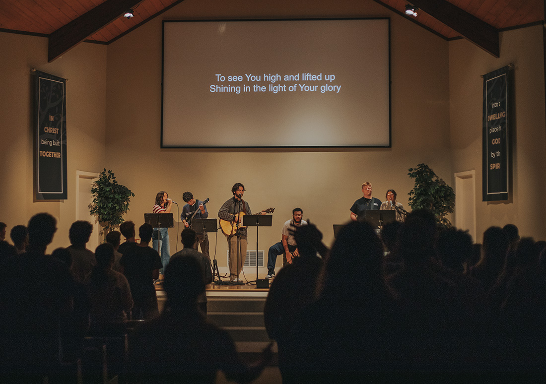 RBC students sing and play instruments during a chapel service