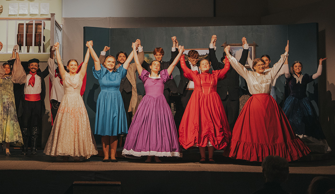 Actors and actresses in the RBC musical Little Women prepare to bow at the end of their show